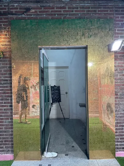 Glass door leading downstairs to the basement studio